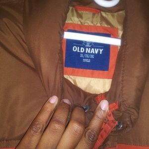 Orang and brown vest